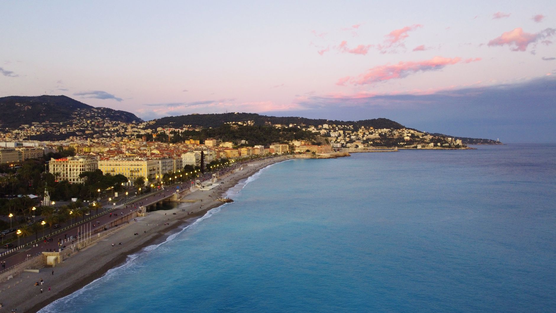 The French Riviera — A breathtaking aerial view of Nice, France, with the Promenade des Anglais and Mediterranean Sea at sunset.