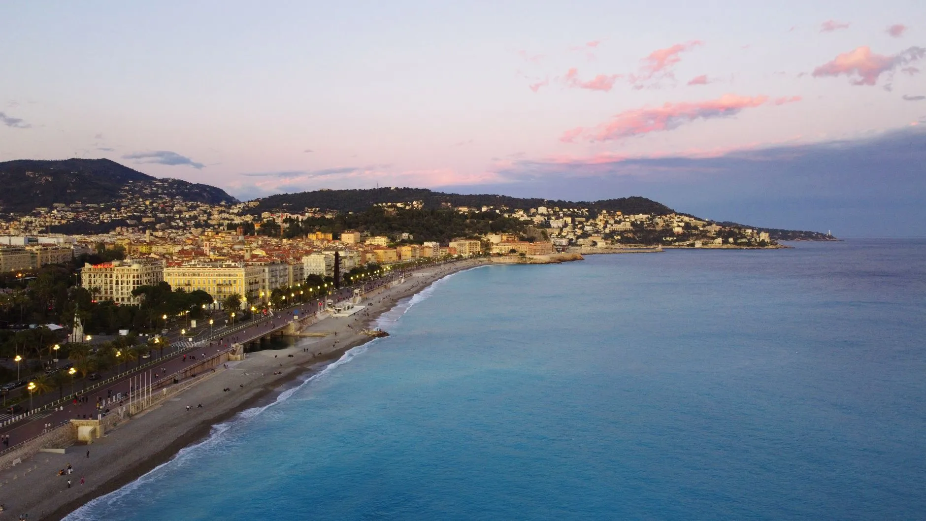 The French Riviera — A breathtaking aerial view of Nice, France, with the Promenade des Anglais and Mediterranean Sea at sunset.