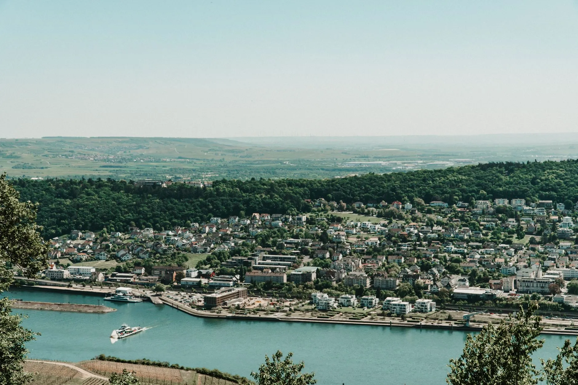 Lower Rhine, Germany — A scenic aerial view showcasing the Rhine River and a quaint German town surrounded by lush greenery.