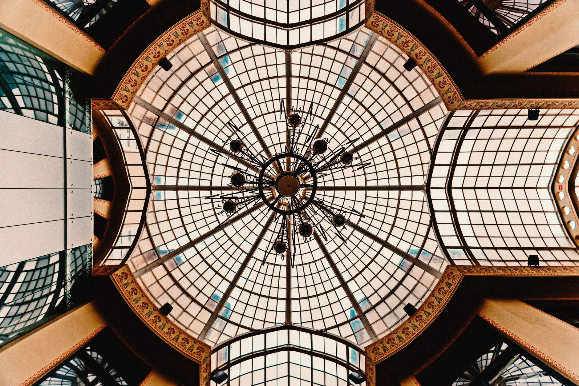 Oradea, Romania — A stunning glass dome ceiling with intricate patterns in Oradea, Romania, captured from below.