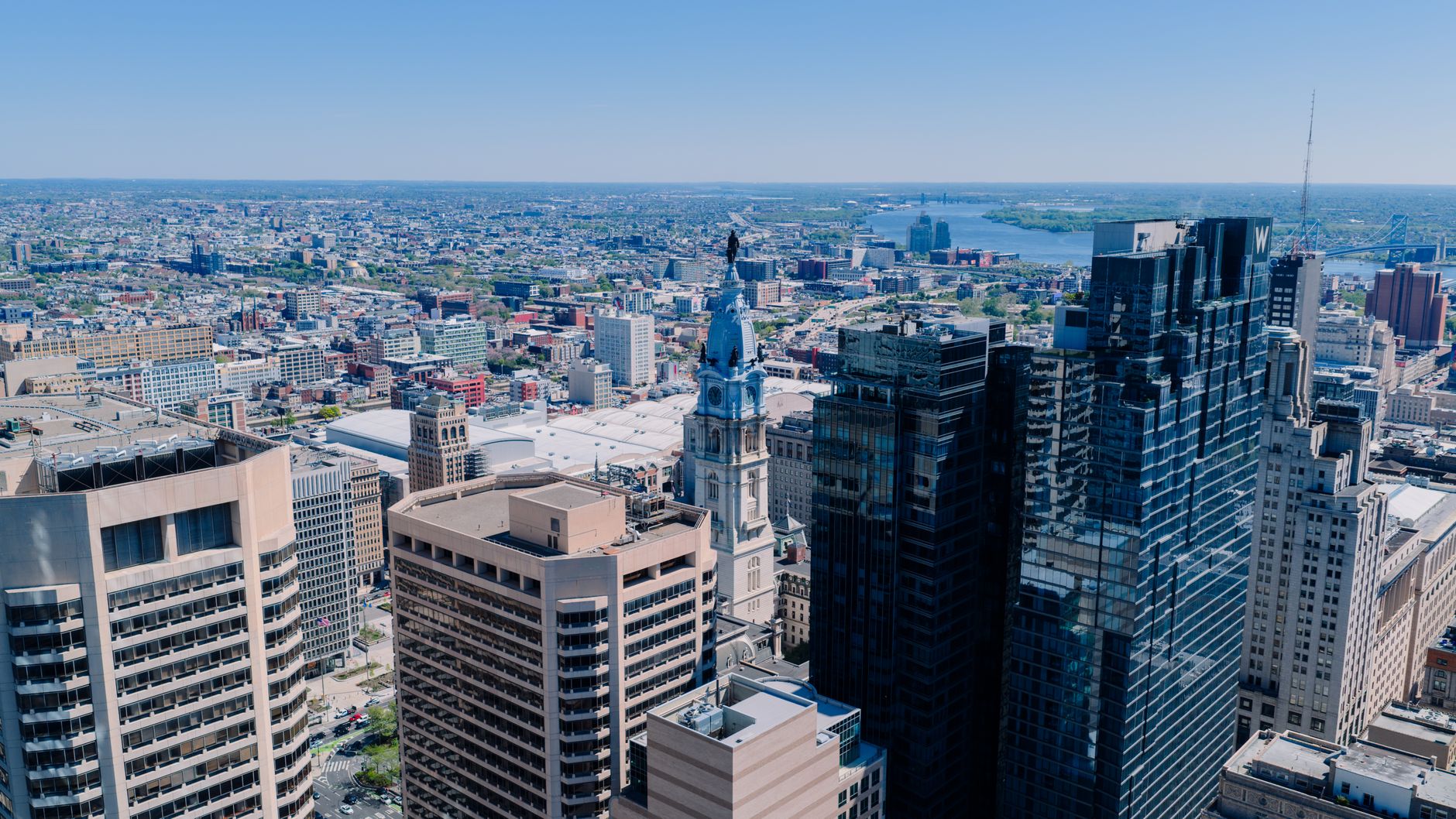 Philadelphia, USA — An aerial view of Philadelphia's skyline featuring the iconic City Hall on a clear day.