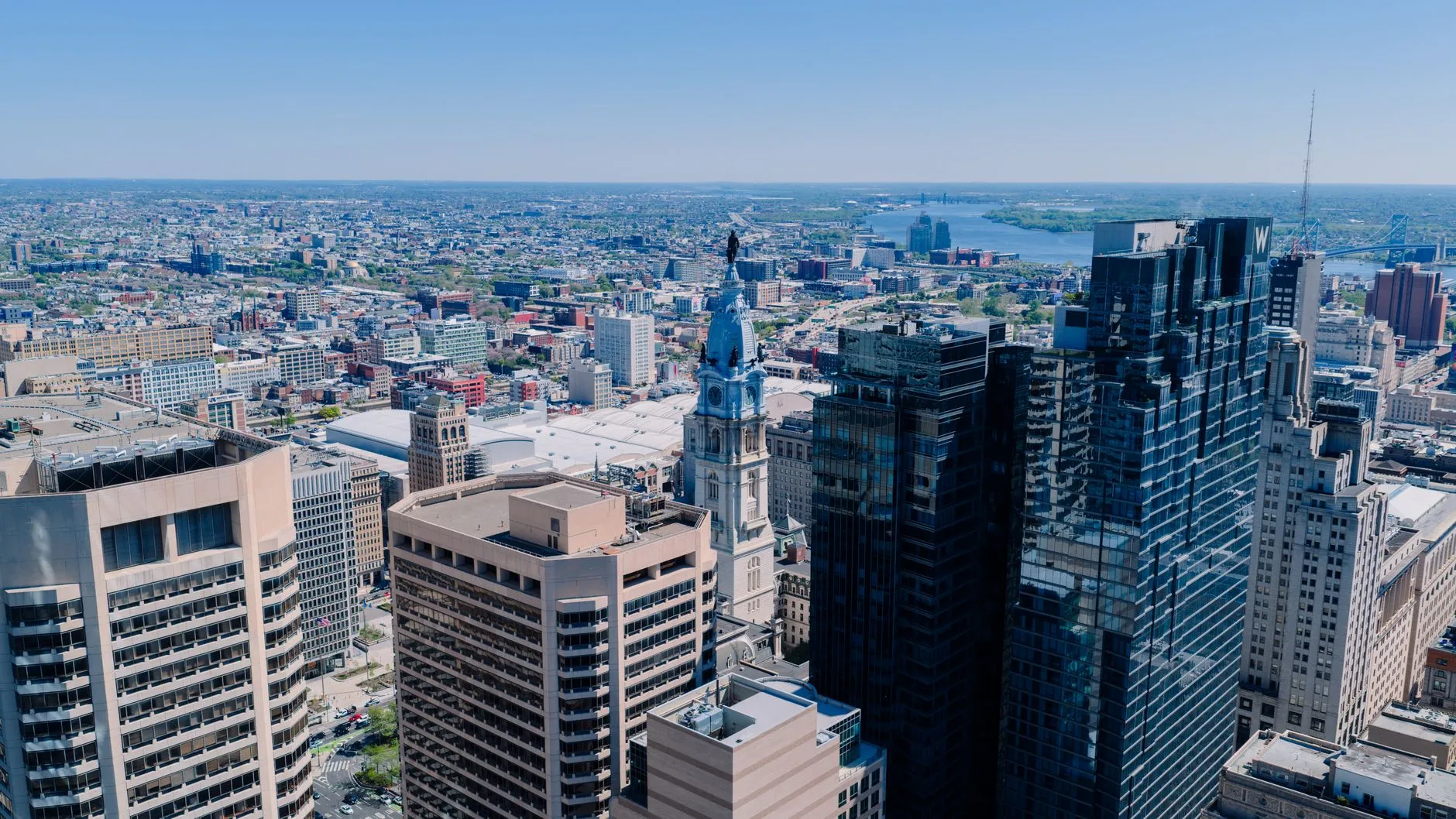 Philadelphia, USA — An aerial view of Philadelphia's skyline featuring the iconic City Hall on a clear day.