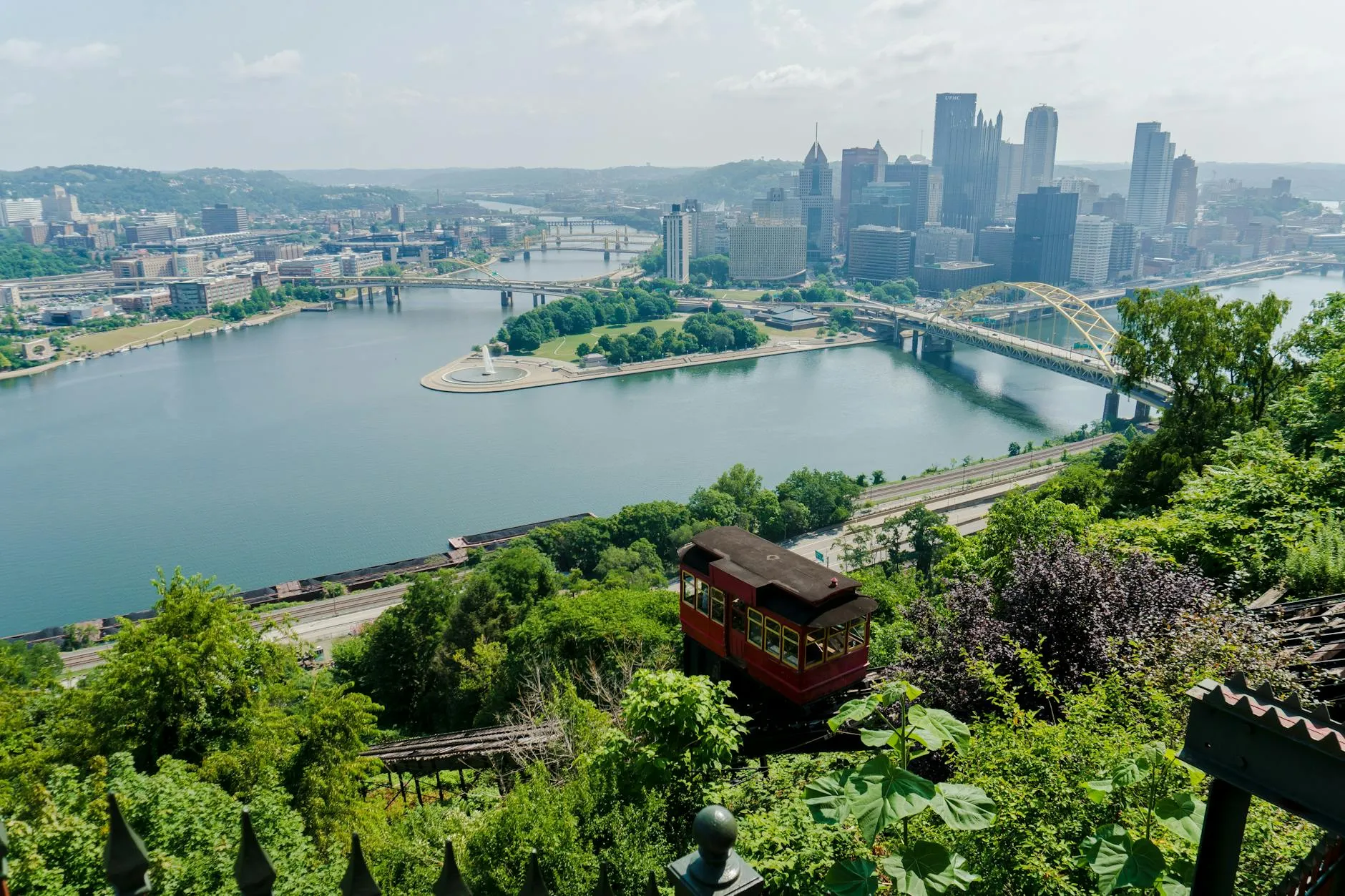 Pittsburgh, USA — A breathtaking aerial view of Pittsburgh's skyline, river, and iconic incline during the day.