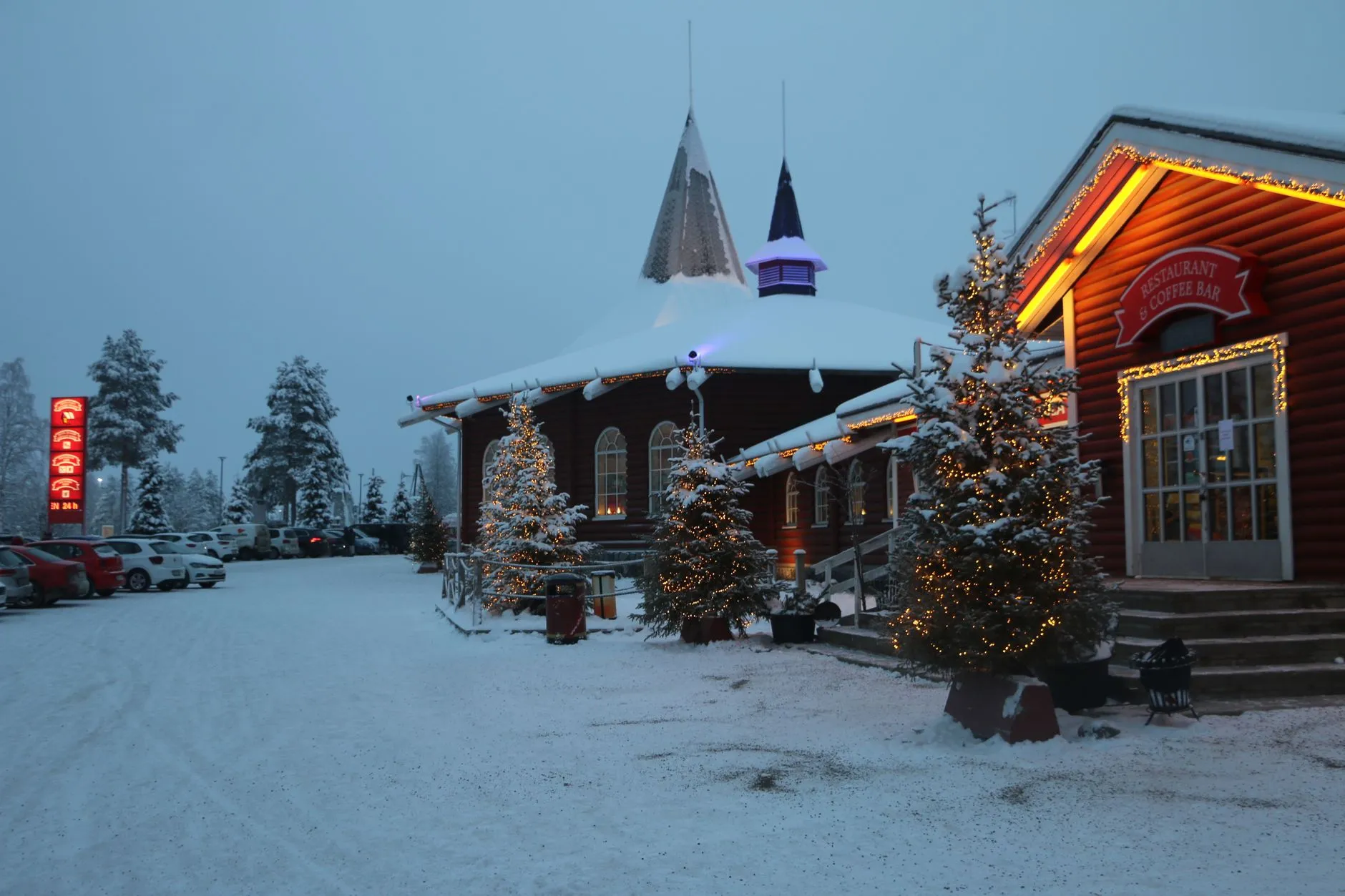 Rovaniemi, Lapland (Finland) — A festive twilight scene of Santa Claus Village in snowy Rovaniemi, Lapland, Finland.