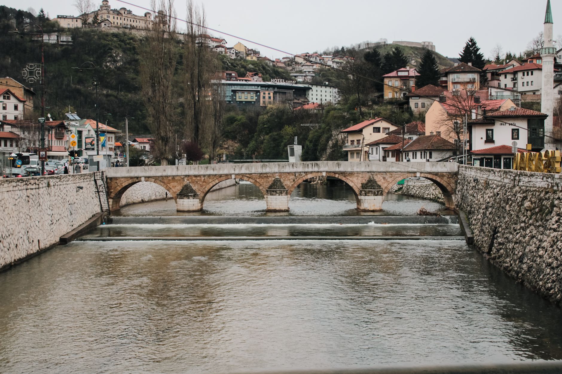 Sarajevo, Bosnia and Herzegovina — Scenic view of a historic stone bridge over the Miljacka River in Sarajevo, Bosnia and Herzegovina.