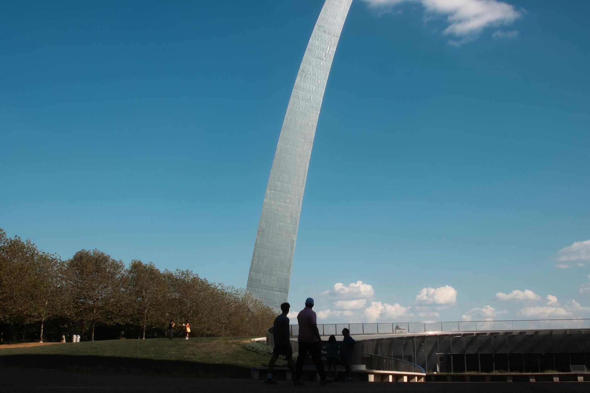 St. Louis, USA — Tourists enjoy an outdoor view of the Gateway Arch in sunny St. Louis, Missouri.