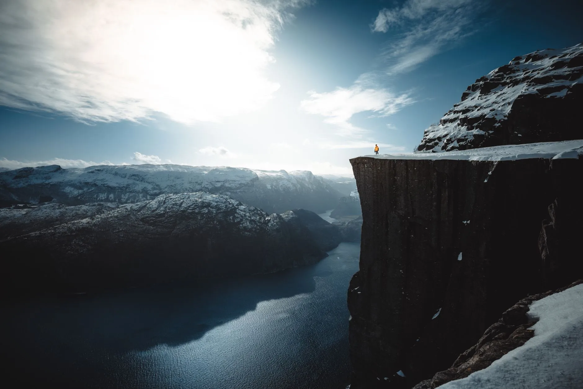 Stavanger, Norway — Snowy Preikestolen cliff overlooking Lysefjord in Norway, capturing winter's serene beauty.