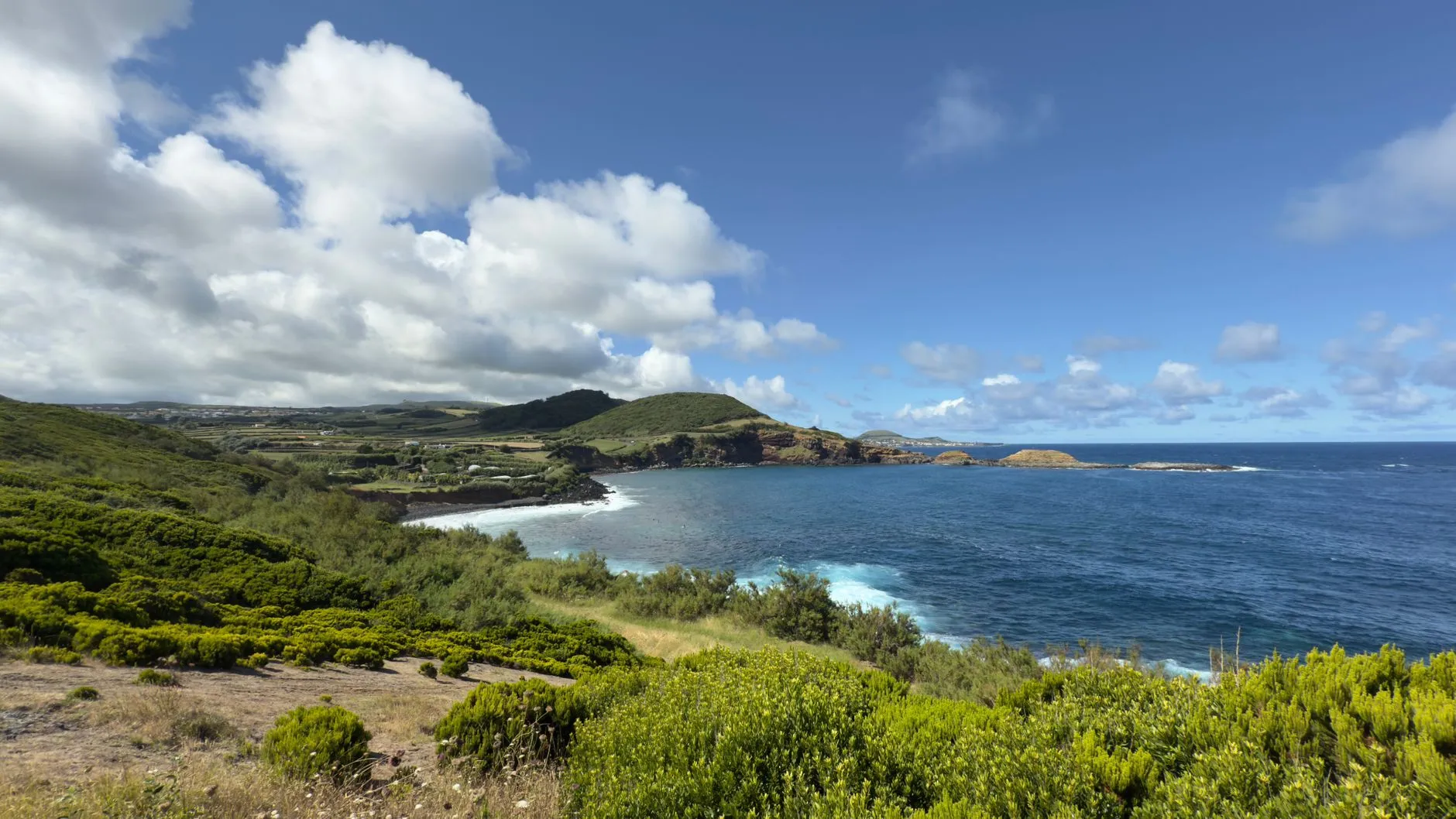 Terceira, Azores — Explore the stunning coastline of Terceira Island in the Azores, featuring lush greenery and vivid blue ocean waters.