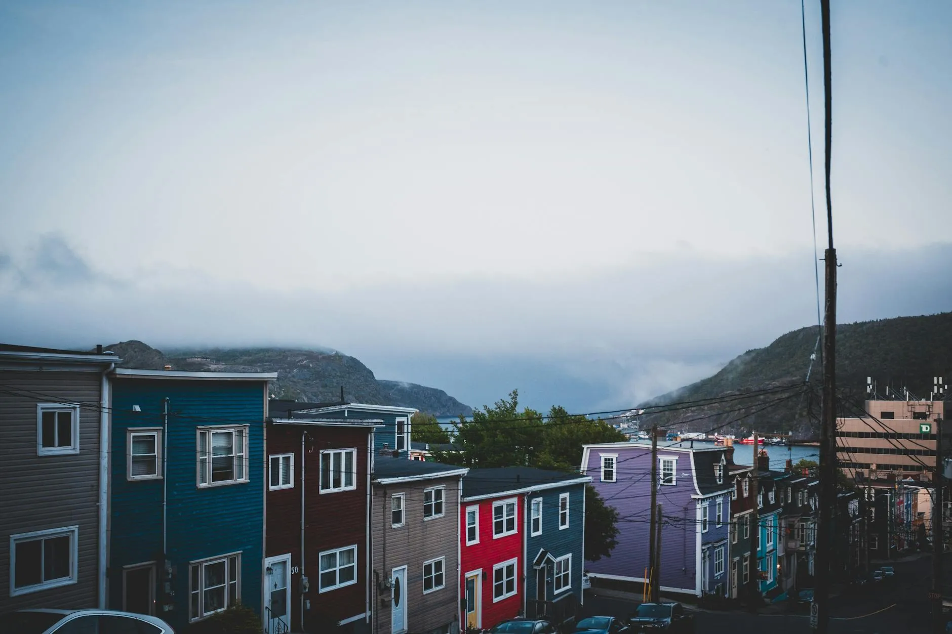 St. John's, Canada — Vibrant jellybean row houses under a cloudy sky in St. John's, Newfoundland.