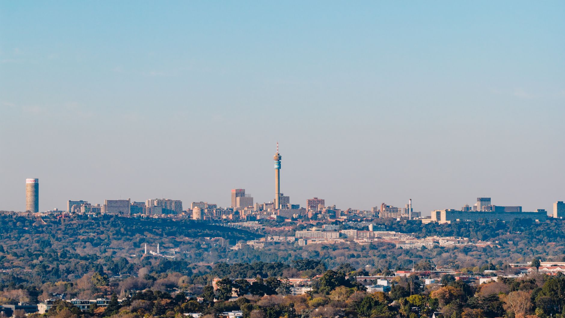 Shot of Johannesburg skyline featuring the iconic Hillbrow Tower on a clear day.