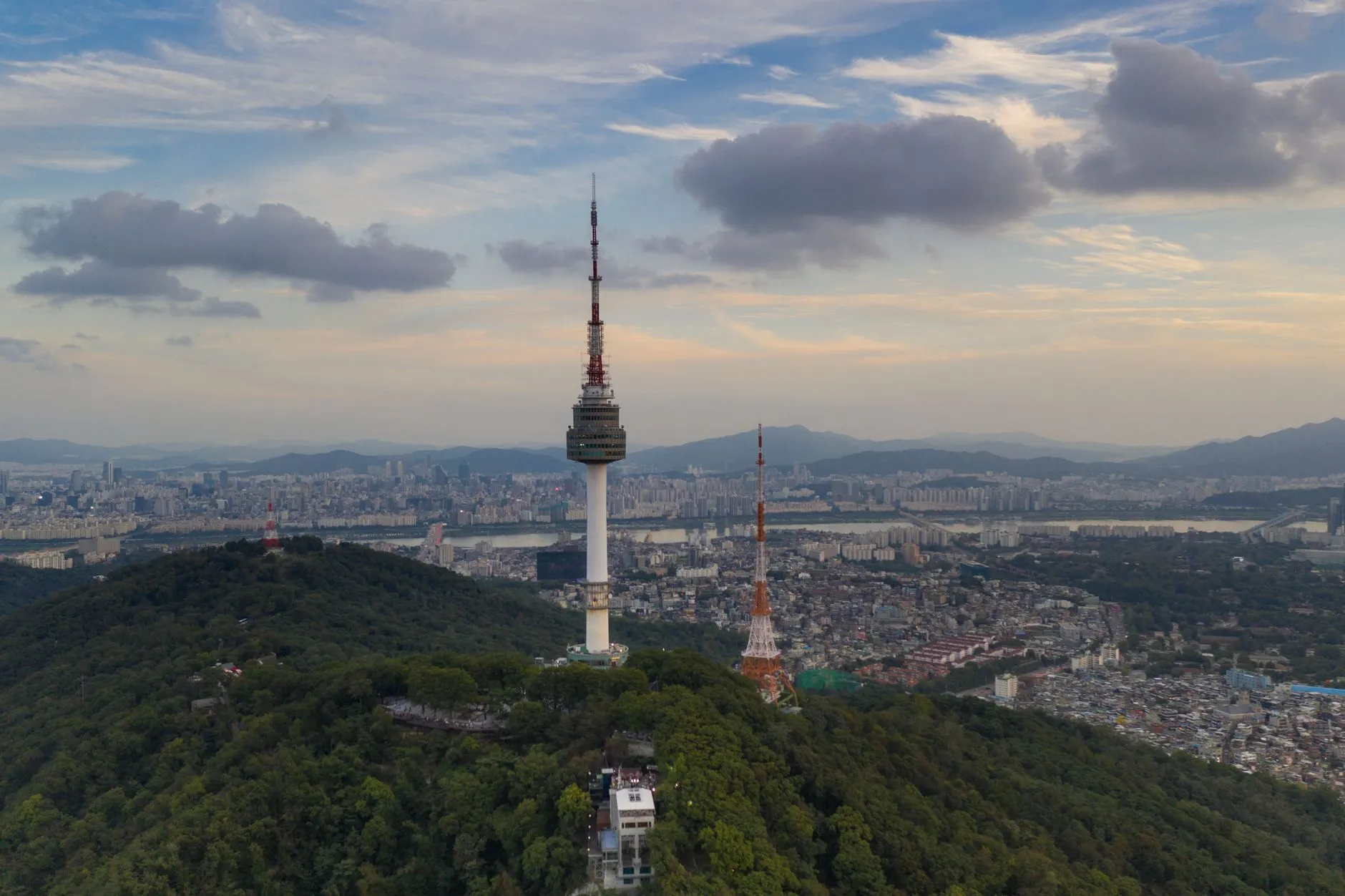 Stunning aerial view of Namsan Seoul Tower with the cityscape at sunset in Seoul, South Korea.