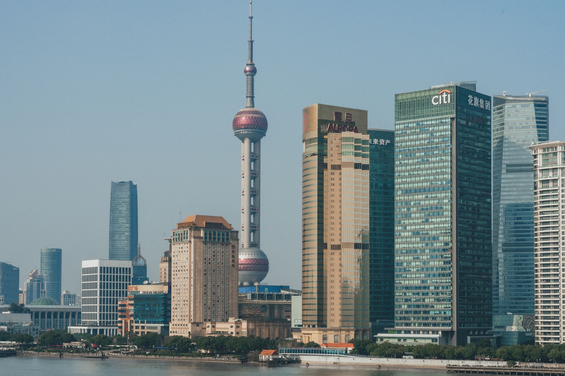 A stunning view of Shanghai's Pudong skyline with the iconic Oriental Pearl Tower and modern skyscrapers.