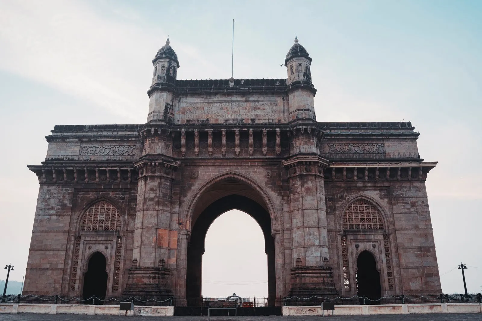 The Gateway of India, the historic basalt arch monument on the Mumbai waterfront, seen head-on in daylight