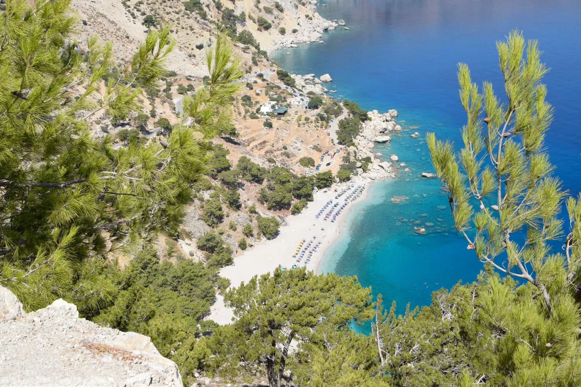 Karpathos, Greece — Stunning aerial view of Kyra Panagia Beach on Karpathos, Greece with turquoise waters and lush greenery.