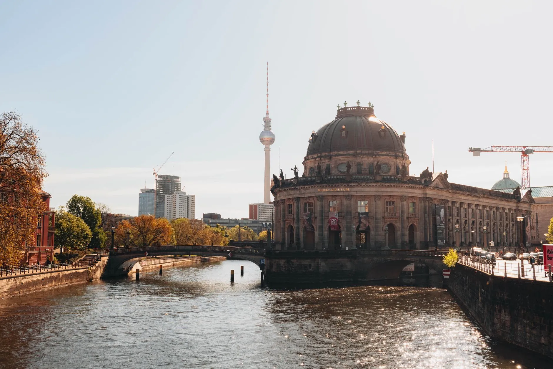 The domed Bode Museum on Museum Island beside the River Spree with the Fernsehturm television tower behind it, Berlin, Germany.