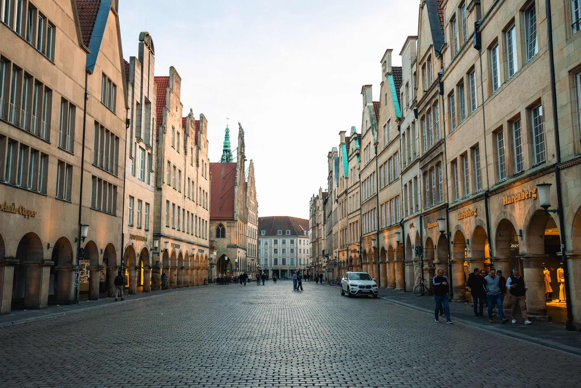 Münster, Germany — Charming street view of the Prinzipalmarkt in Münster, Germany at dusk with historic architecture.