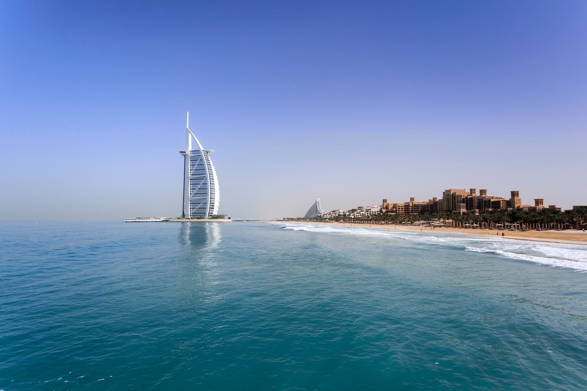 Dubai, UAE — the Burj Al Arab and Jumeirah Beach under a clear sky