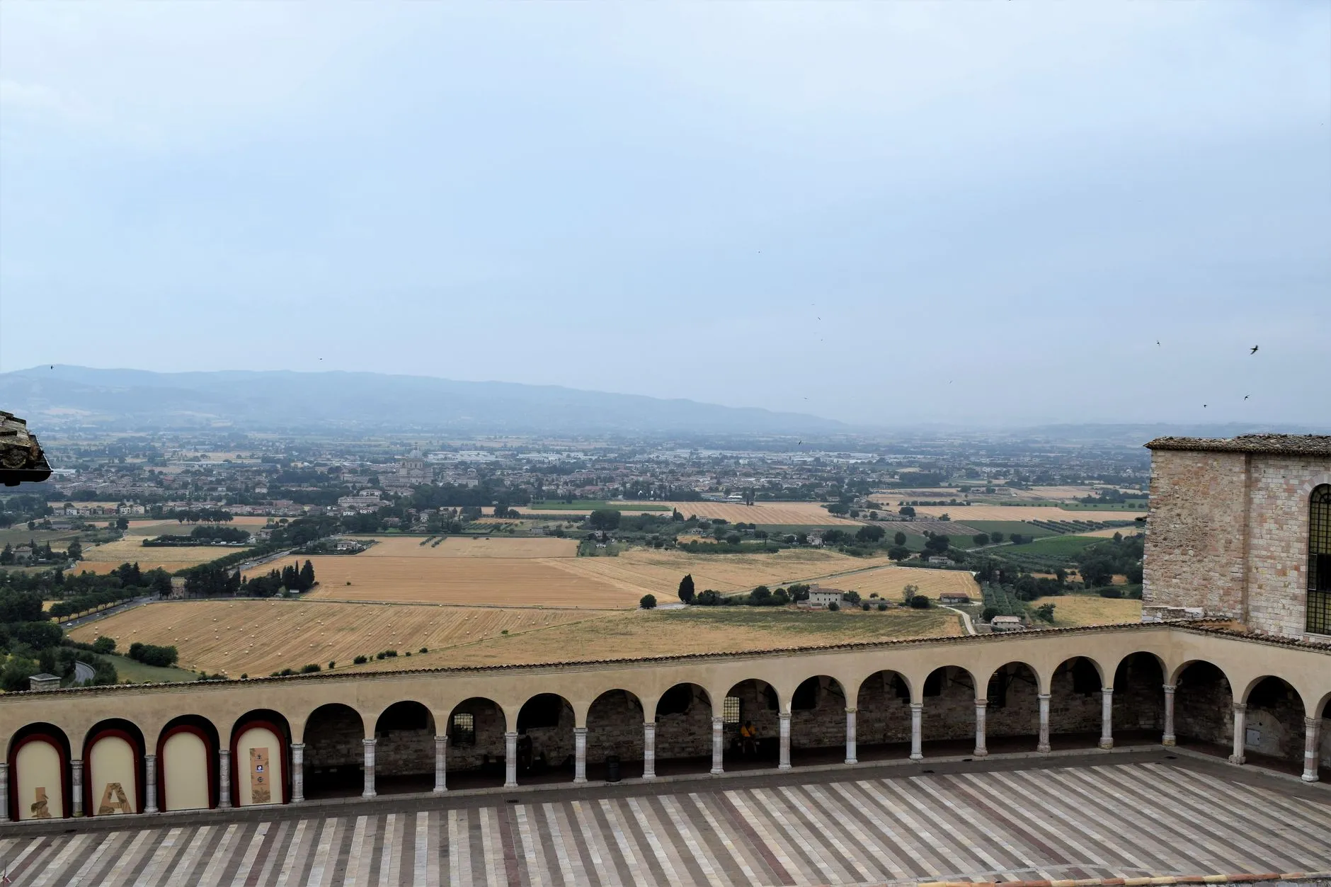 Umbria, Italy — Explore the beautiful Umbrian countryside from Assisi, Italy with stunning views and historic architecture.