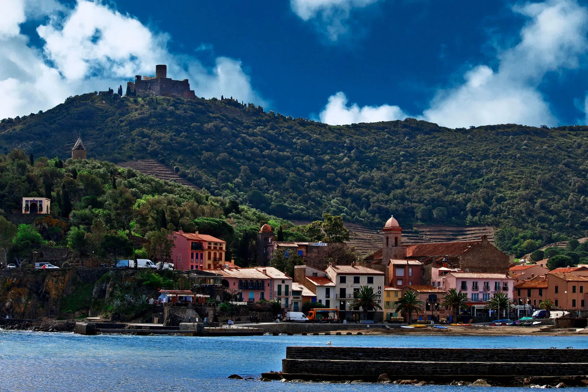 Perpignan, France — Stunning coastal view of Collioure, France with historic castle and colorful houses.