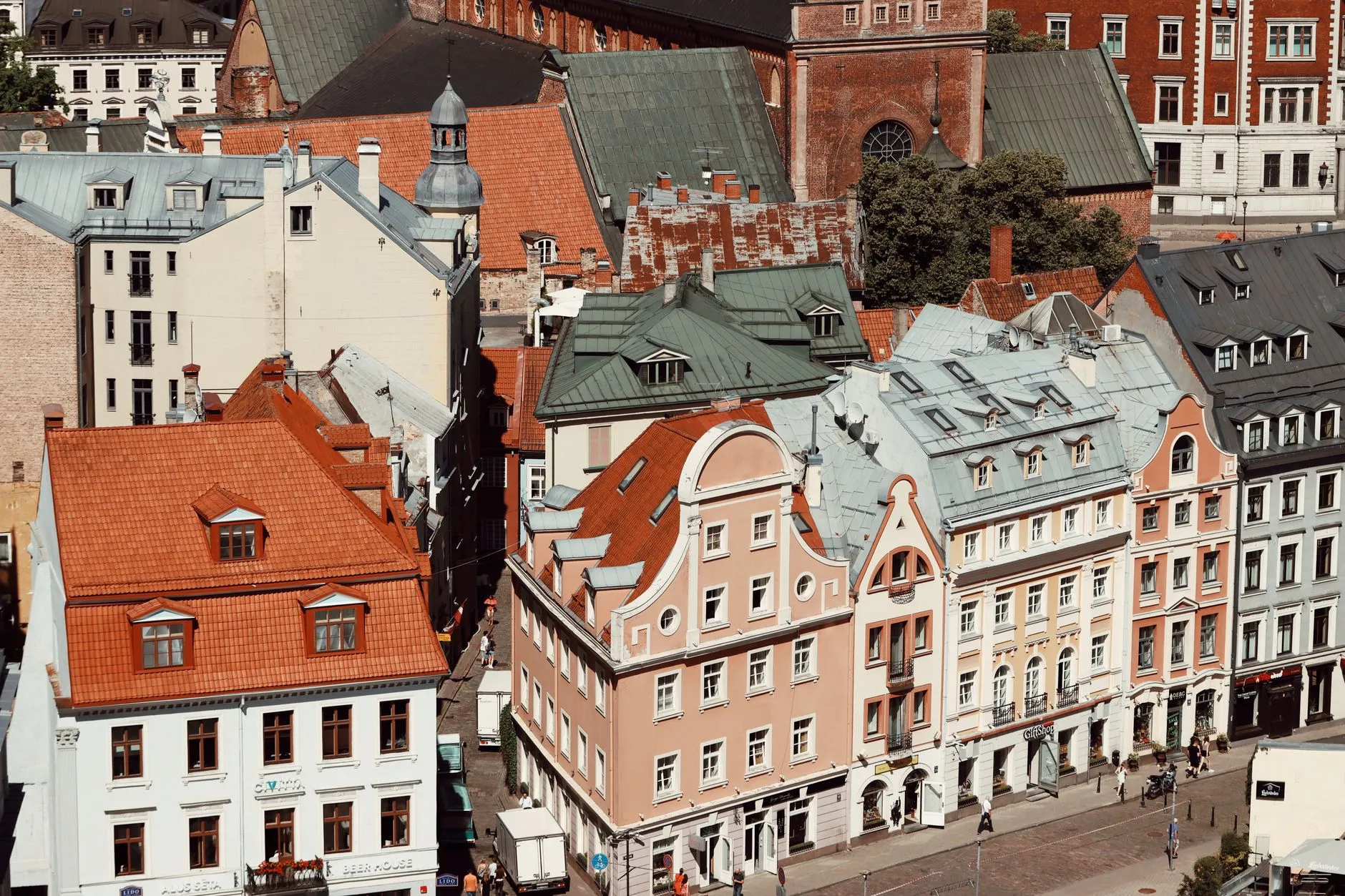 Riga, Latvia — sunlit Old Town rooftops and gabled facades
