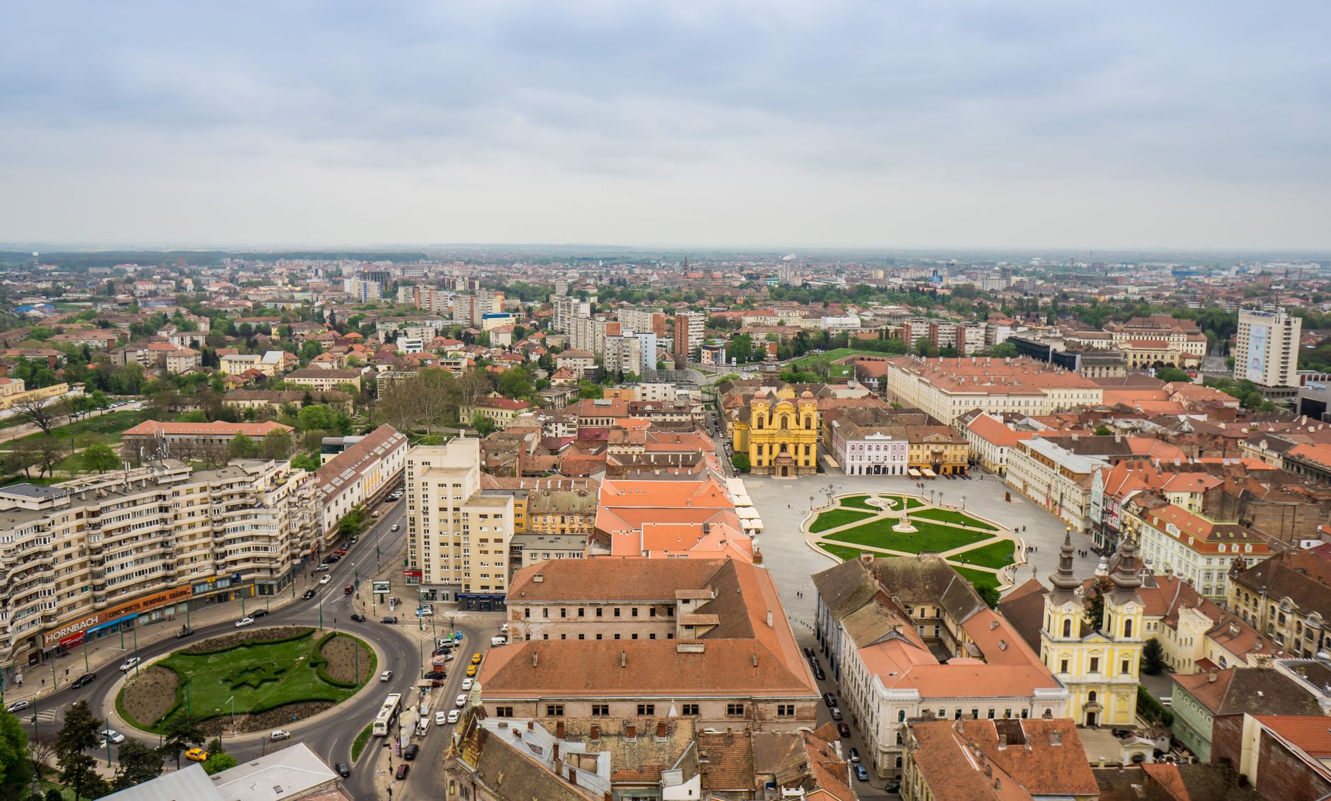 Timisoara, Romania — Stunning aerial view of Timișoara's Union Square, featuring historical buildings and vibrant cityscape.