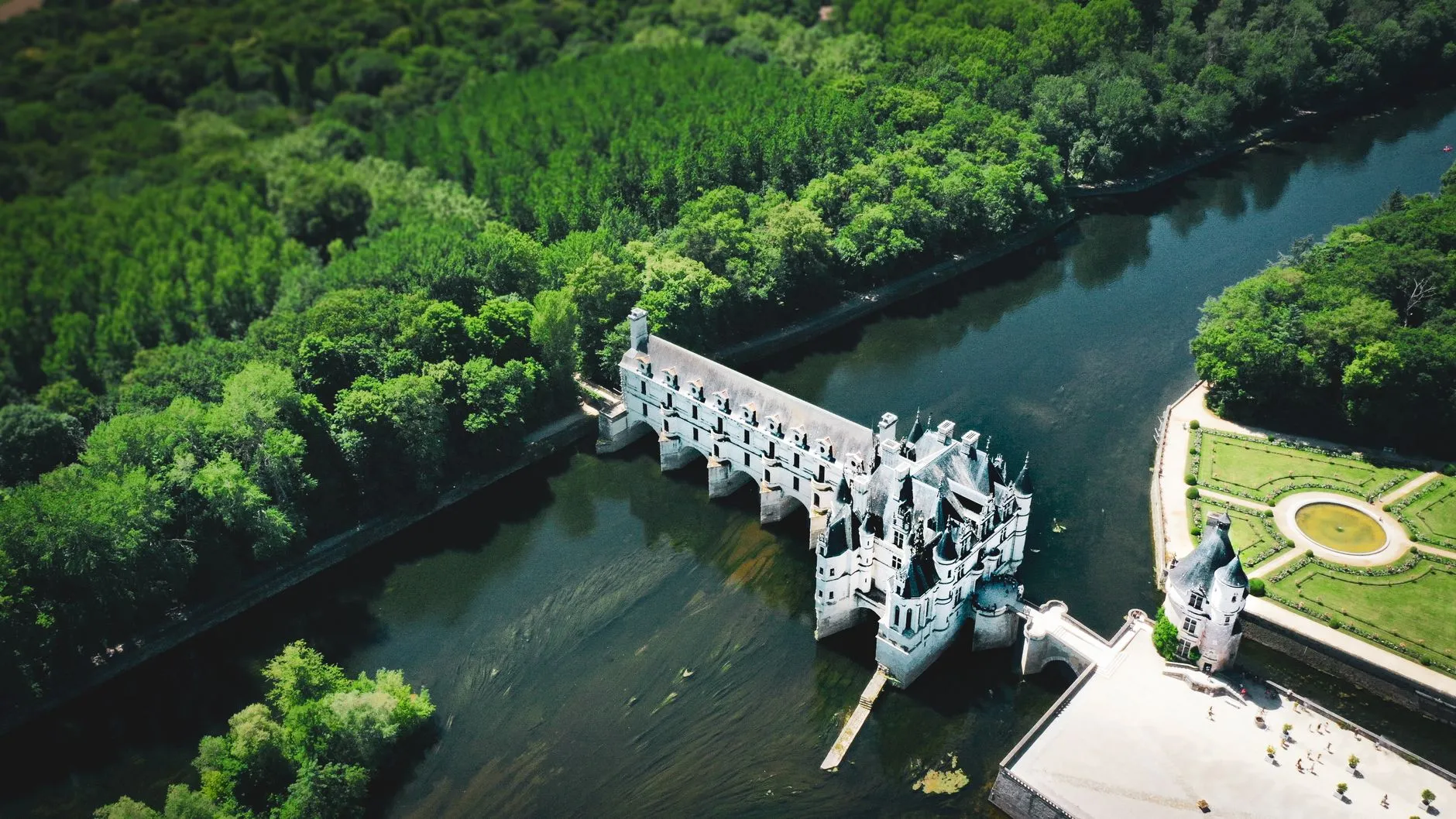 Tours, France — Stunning aerial view of Château de Chenonceau surrounded by lush greenery in Centre-Val de Loire, France.