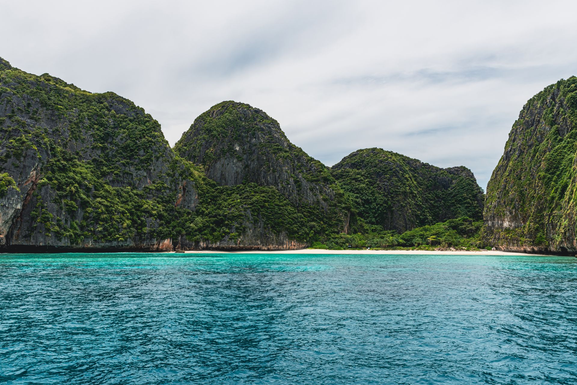 Turquoise waters and limestone cliffs near Phuket, Thailand.