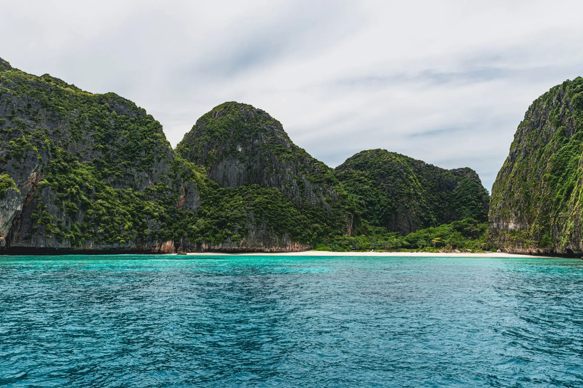 Turquoise waters and limestone cliffs near Phuket, Thailand.