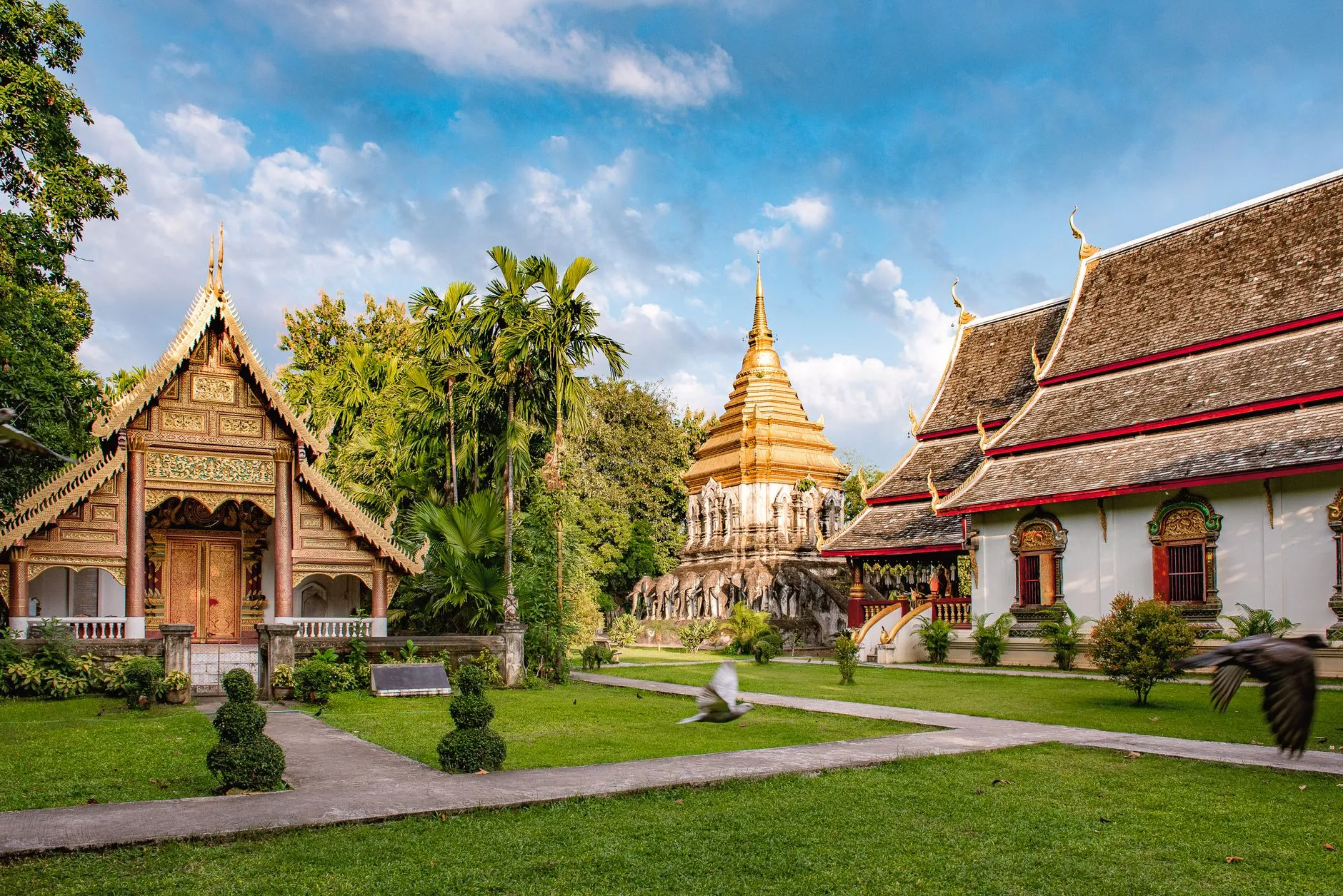 Chiang Mai, Thailand — Wat Chiang Man's golden elephant chedi and Lanna halls