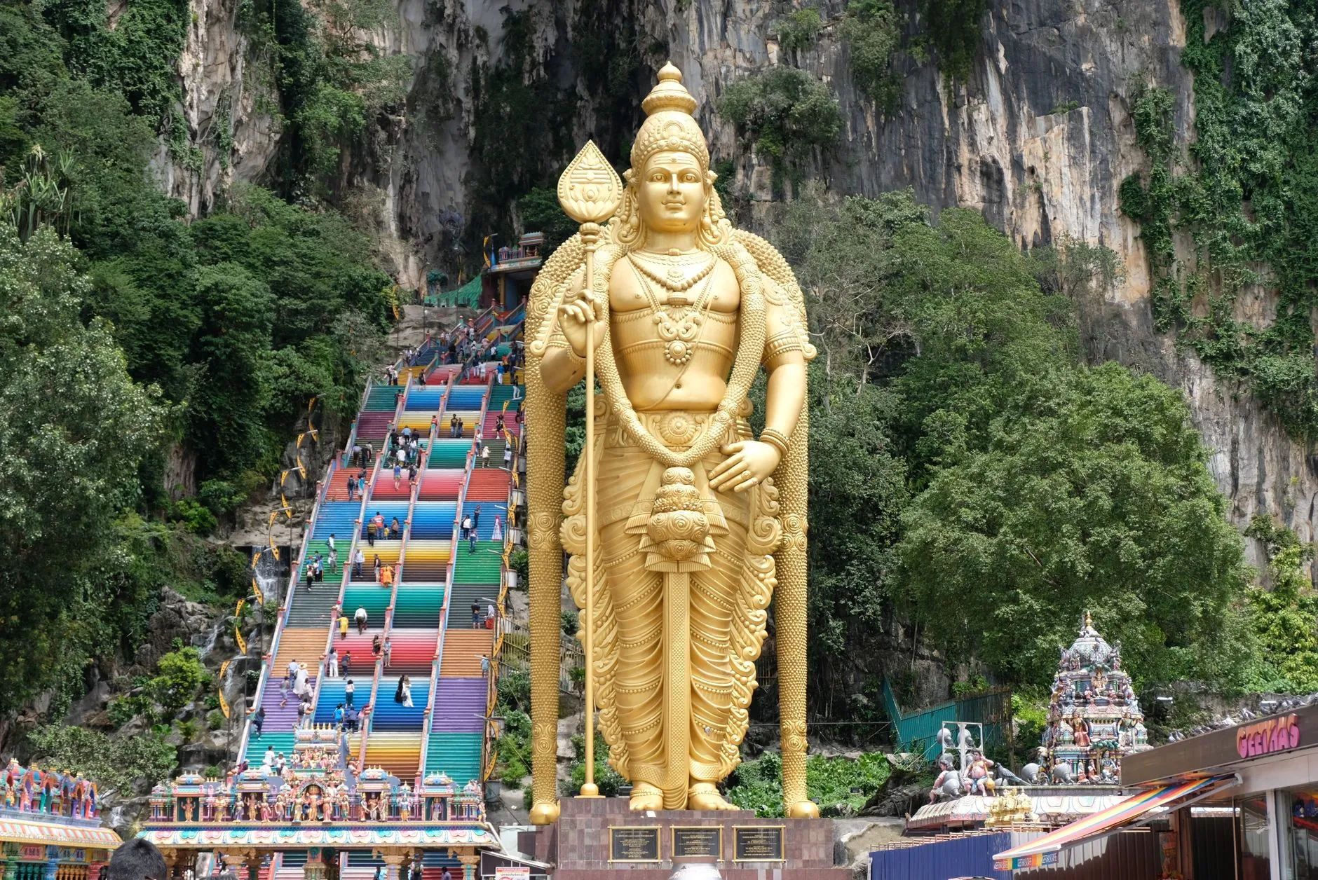 Kuala Lumpur, Malaysia — the golden Murugan statue and rainbow steps at Batu Caves