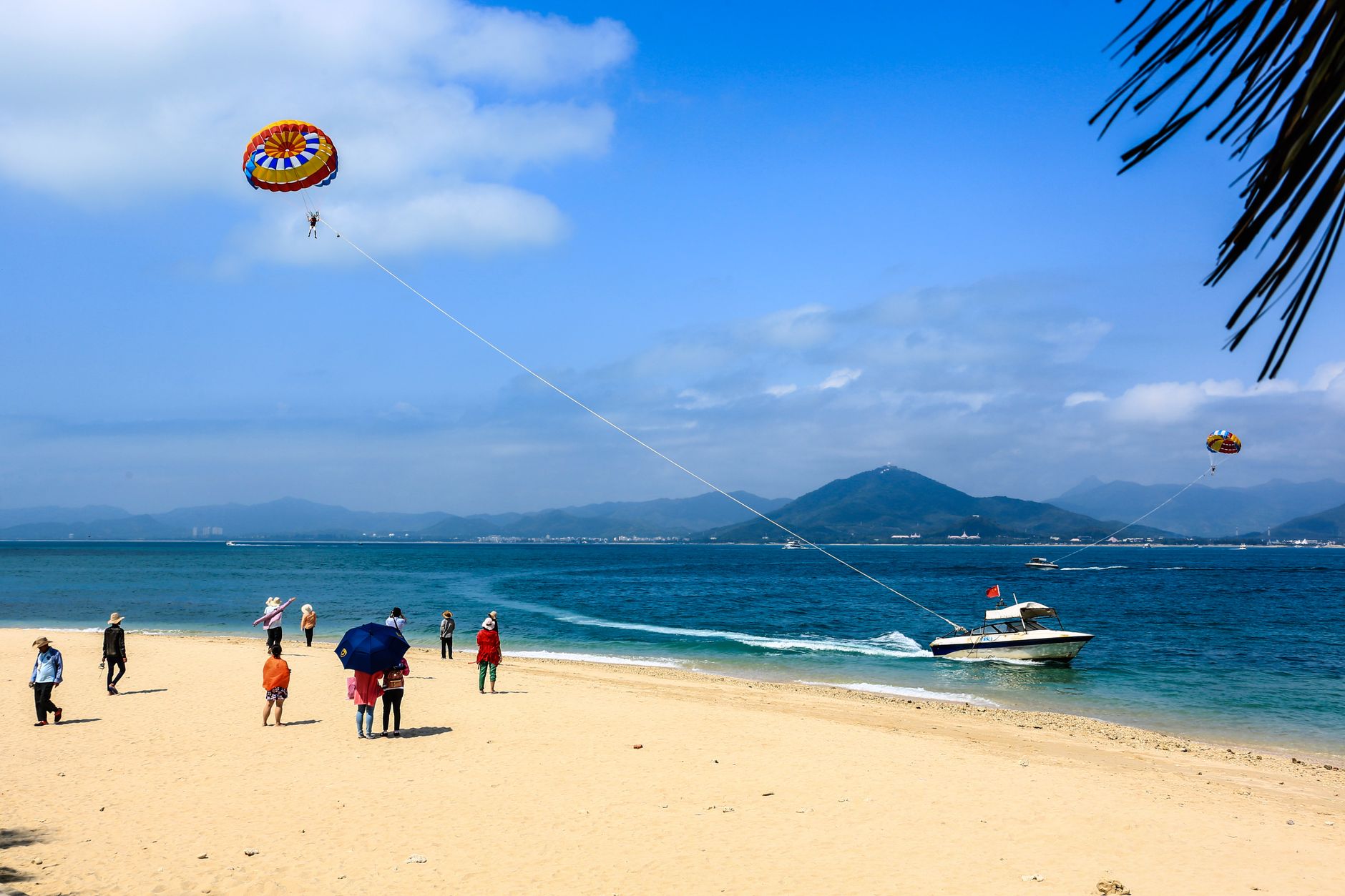 Sanya, Hainan — sandy beach and turquoise sea under a blue sky