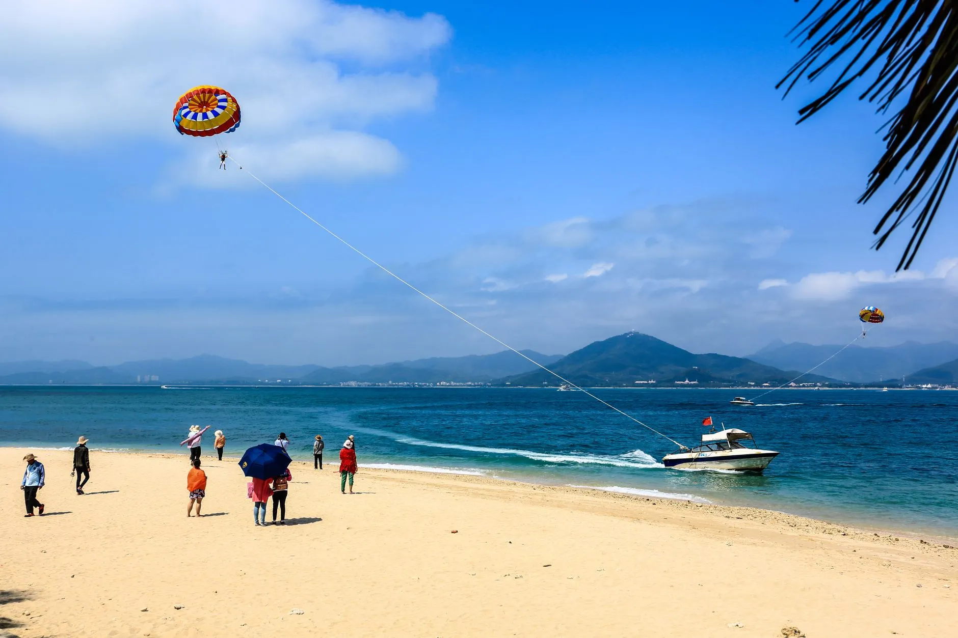 Sanya, Hainan — sandy beach and turquoise sea under a blue sky